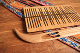 Double slotted rigid heddle with 11 pattern strings - Harvest Looms