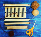 from above backstrap strap loom kit with yarn and natural lighting